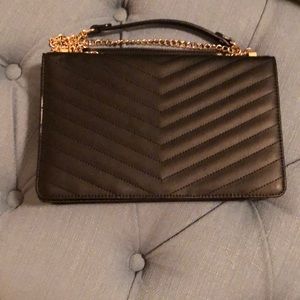 Soft Black purse /  gold strap.  Like new .